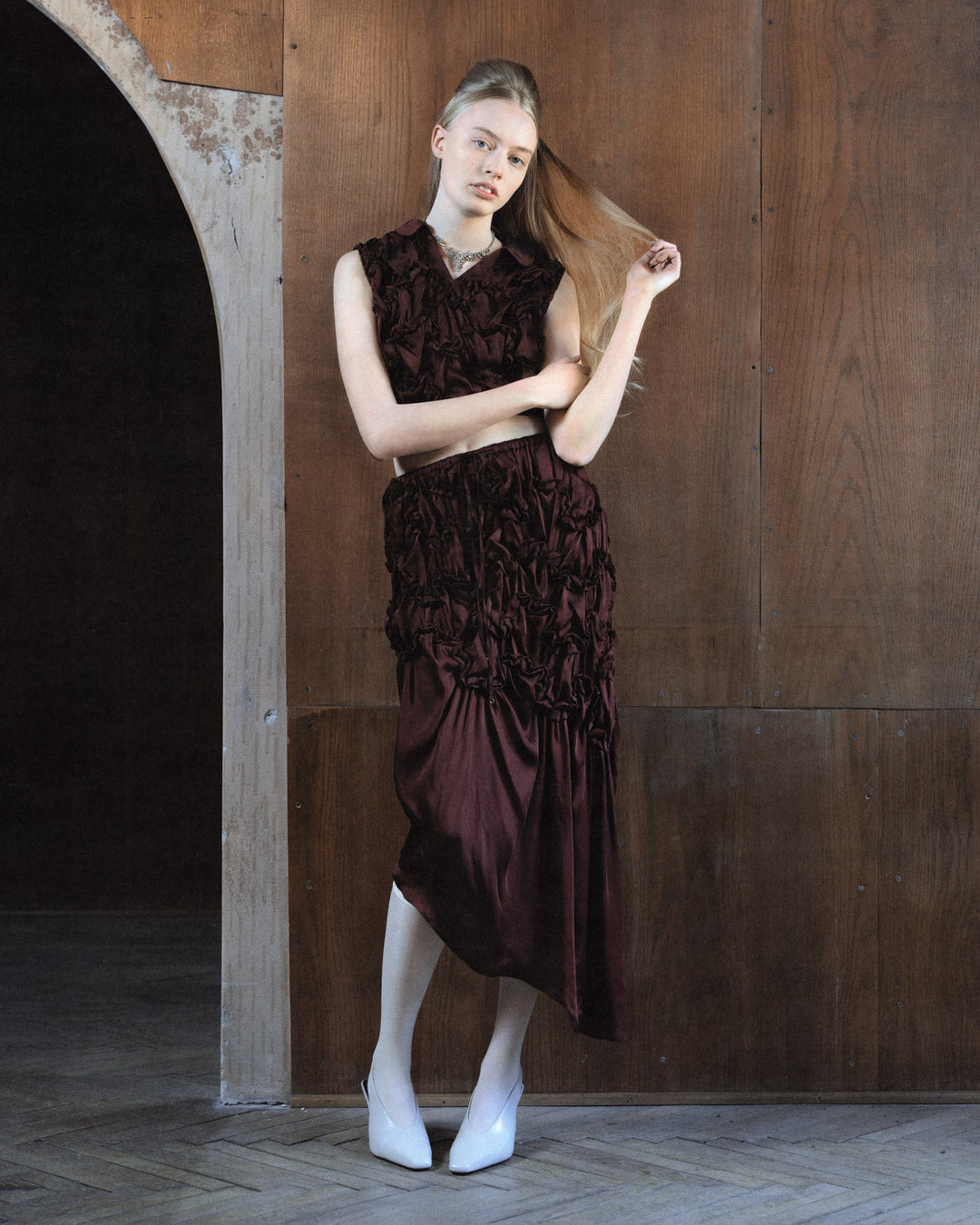 Hisu Park Jenny Skirt in deep burgundy satin with ruched floral-style gathered detailing on the upper skirt and an asymmetric draped midi hem - view 6
