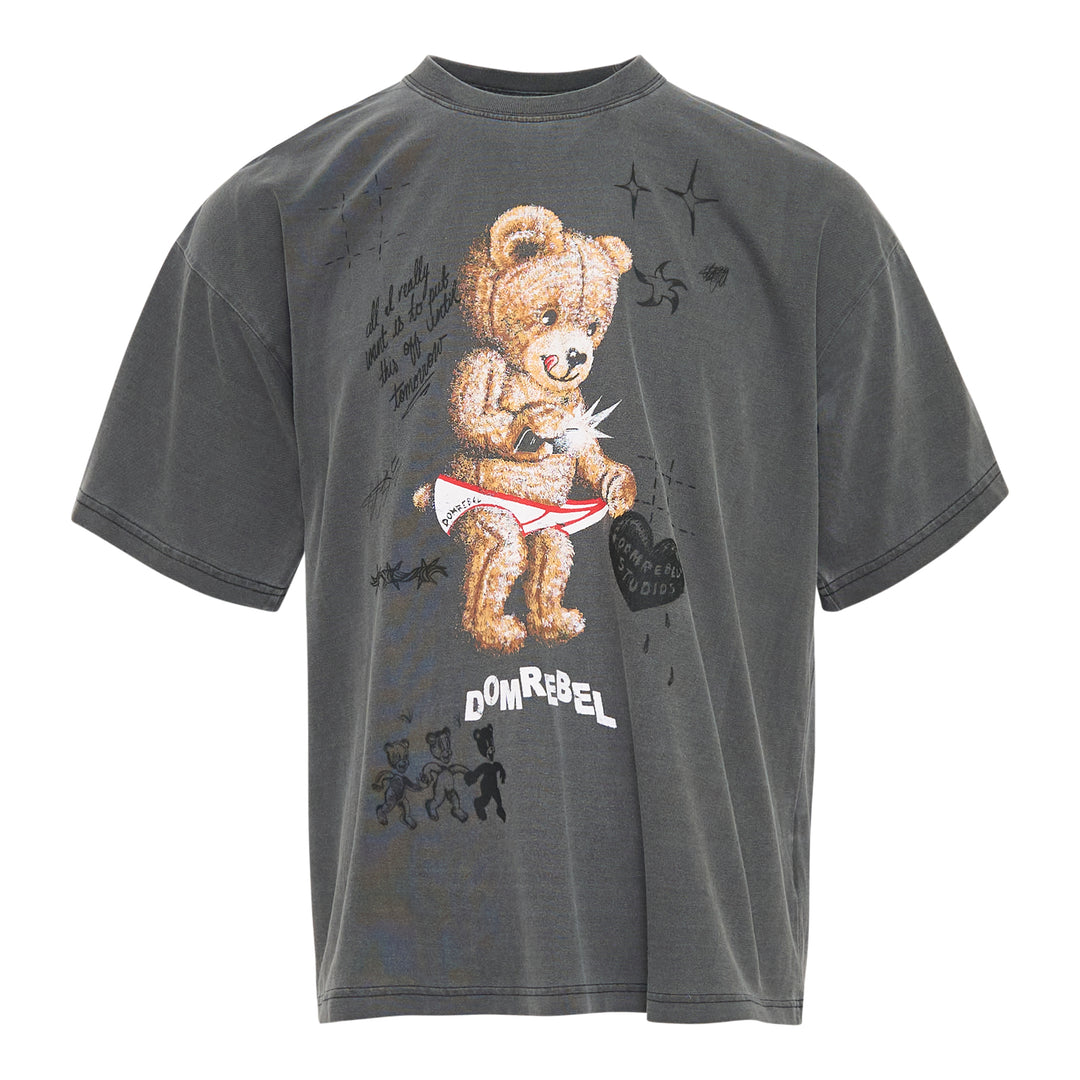 Domrebel washed grey oversized graphic tee featuring a large teddy bear in briefs, hand-scrawled typography, star and barbed wire motifs, and Domrebel Studios branding
