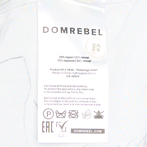 Domrebel Camp Collar Short Sleeve Shirt in light grey with an all-over dark ink hand-drawn sketch graphic print featuring grotesque faces and abstract figures, shown flat on a white background