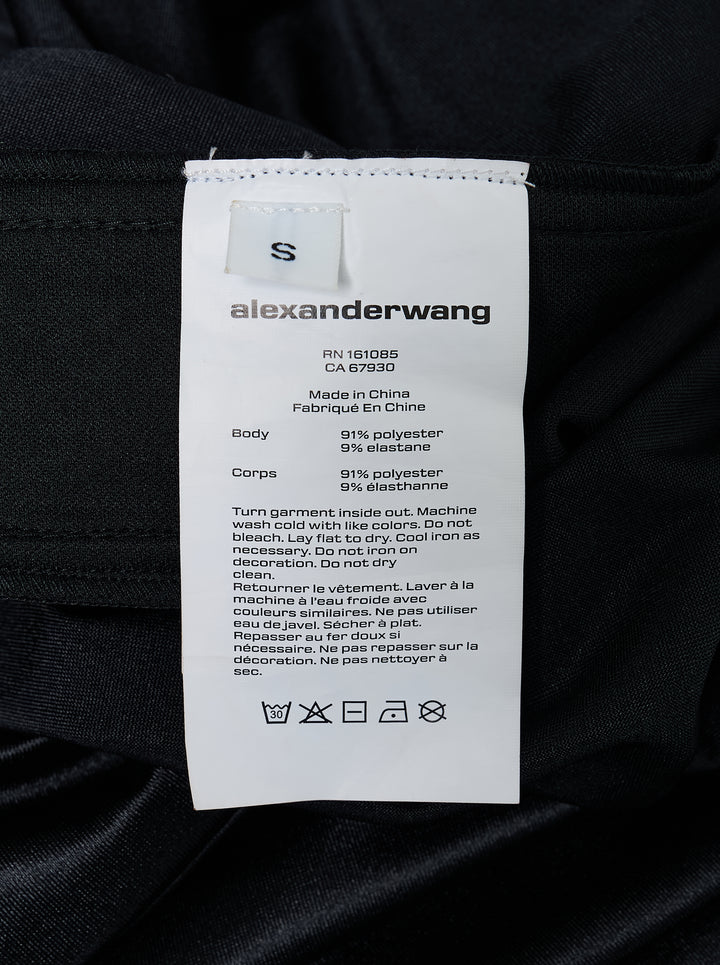 Alexander Wang mid-rise black glossy track pants with embossed side logo panels and elasticated waistband, shown from the front - view 4