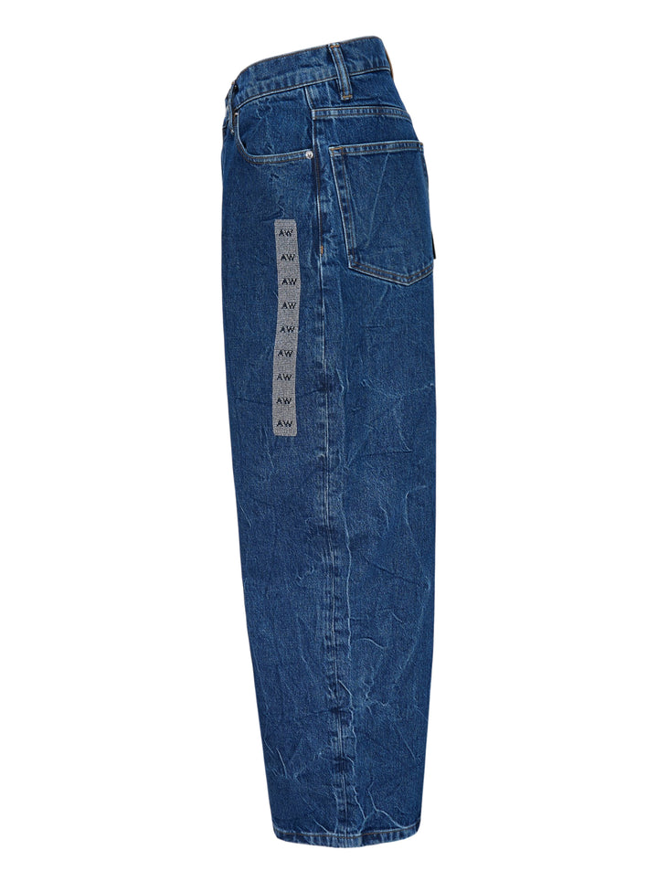 Alexander Wang unisex wide-leg jeans in crinkled mid-blue denim with a woven AW monogram flasher at the hip - view 3