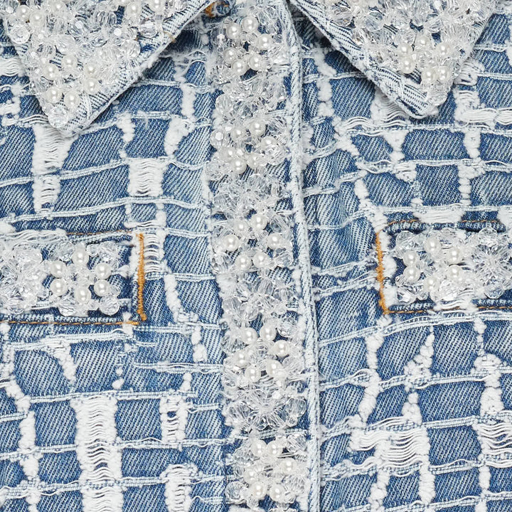 Self-Portrait blue textured tweed-effect denim mini dress with spread collar, lace trim detail, gold lion-head buttons, chest and patch pockets, and short sleeves