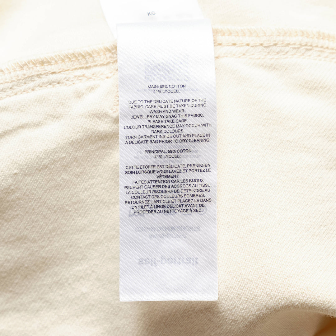 Self-Portrait cream denim high-waist shorts with wide-leg A-line silhouette, triple-button closure, and large front patch pockets