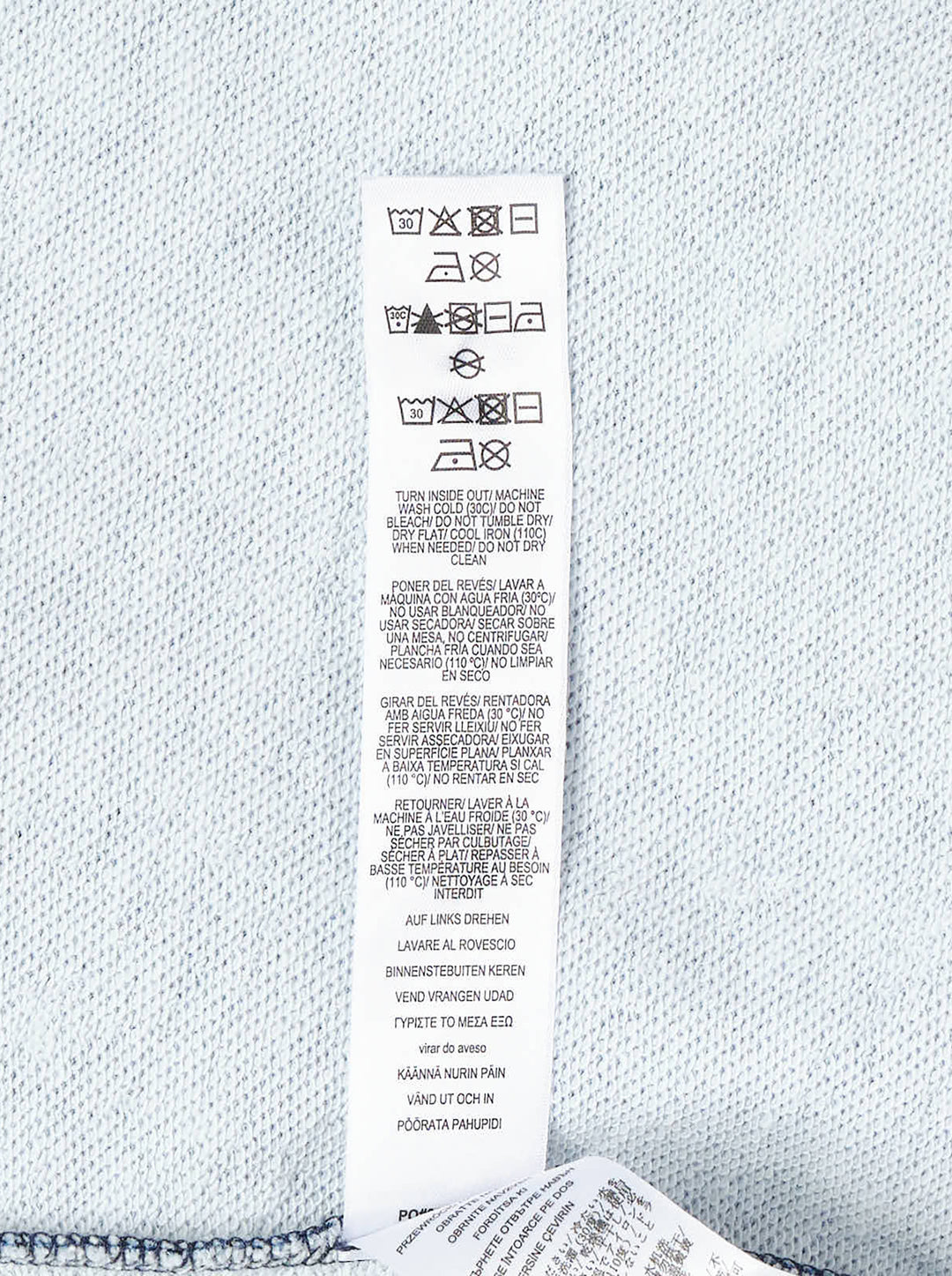 rag & bone Miramar Side Fray Polo Shirt in medium-wash denim with snap-button placket, contrast piping along the shoulder seams, raw fray detailing, and a drawstring cropped hem - view 4