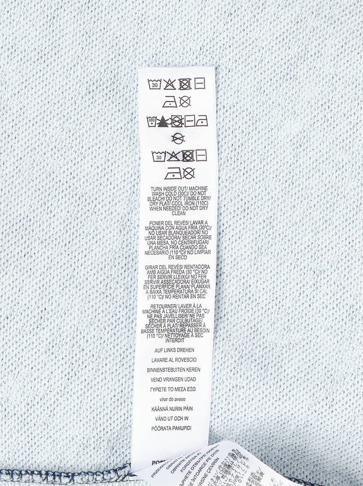 rag & bone Miramar Side Fray Polo Shirt in medium-wash denim with snap-button placket, contrast piping along the shoulder seams, raw fray detailing, and a drawstring cropped hem - view 4