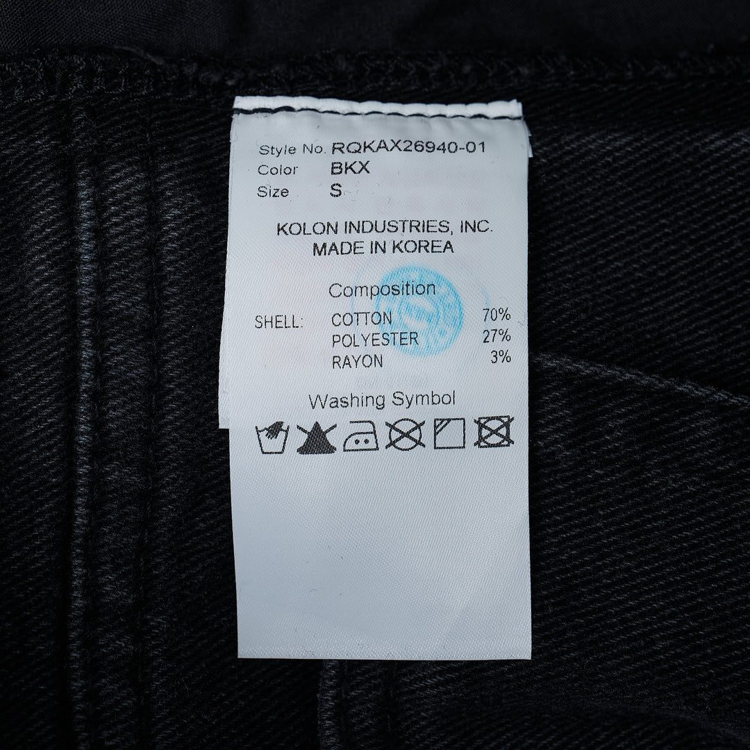 Re;Code Inside-Out Denim Skirt in washed black, midi length with a front slit, raw frayed hem, and five-pocket detailing on a white background