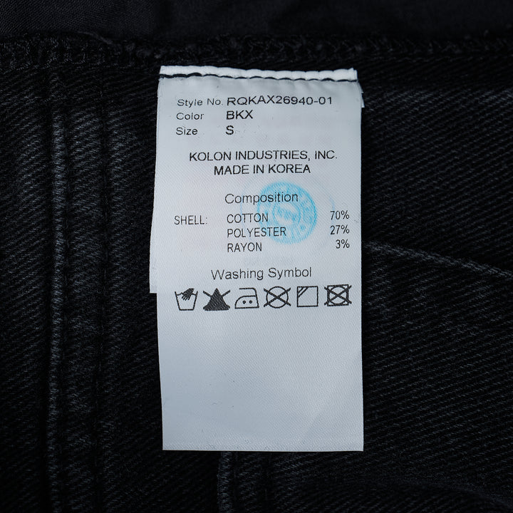 Re;Code Inside-Out Denim Skirt in washed black, midi length with a front slit, raw frayed hem, and five-pocket detailing on a white background