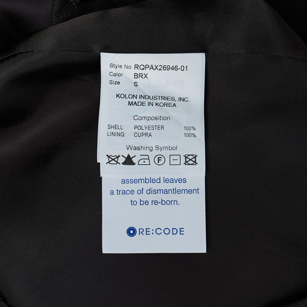 RE;CODE pleated tailored shorts in charcoal, featuring a high waist, double front pleats, wide-leg silhouette, and woven brand label at the waistband