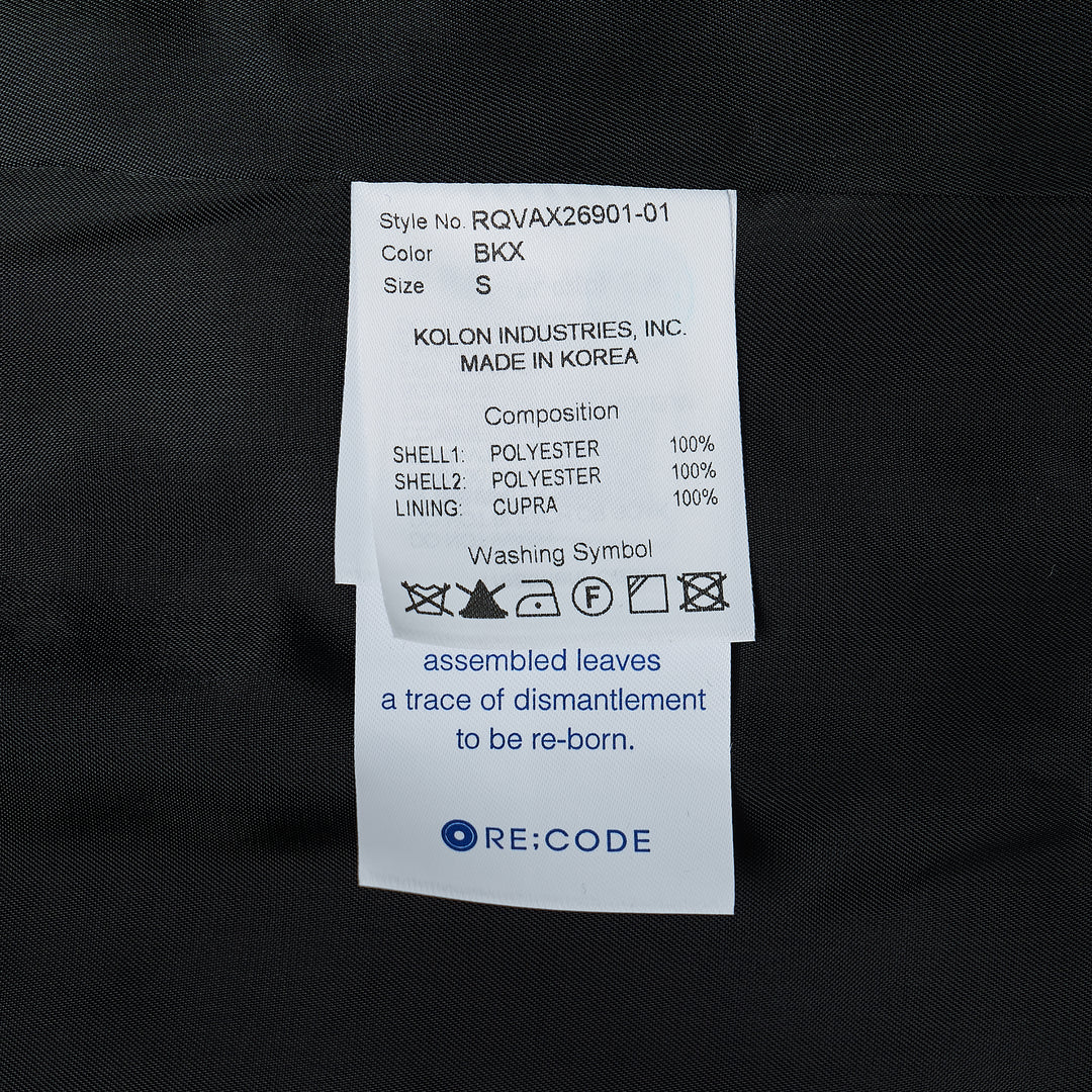 Re;Code Layered Raw-Edged Vest in black, featuring raw shoulder seams, contrast white basting stitches along the V-neckline, three-button closure, chest pocket, two lower flap pockets, and a woven Re;Code Limited branded patch