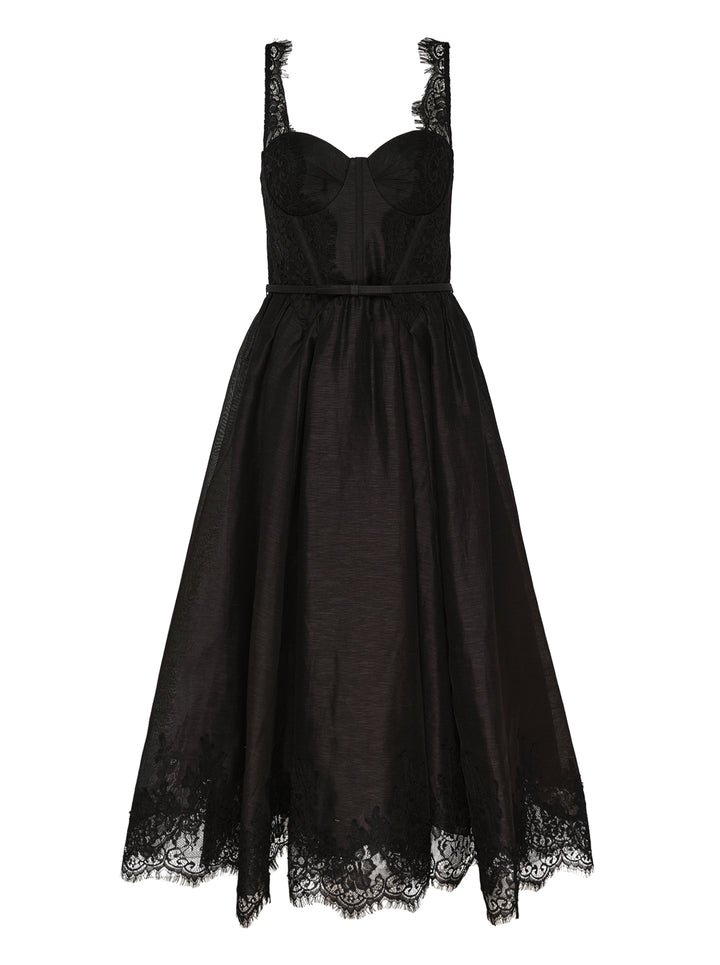 Zimmermann Valiant Lace Trim Midi Dress in black, featuring a structured corset bodice with lace overlay, wide lace straps, voluminous semi-sheer organza skirt, ribbon waist tie, and deep scalloped lace hem border