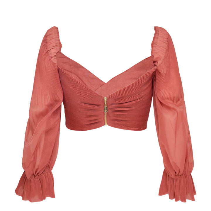 Zimmermann Pleated Bodice Wrap Top in terracotta, featuring a crossover pleated front, voluminous puff sleeves in crinkled woven fabric, and ruffled elasticated cuffs