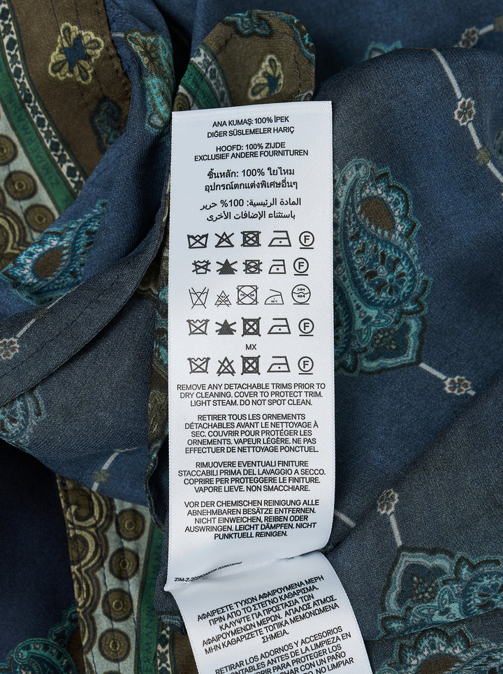 Zimmermann Ascent Harem Pants in navy with teal and gold paisley print, featuring a gathered silhouette, ornate woven waistband, and elasticated ankle cuffs with decorative border trim - view 3