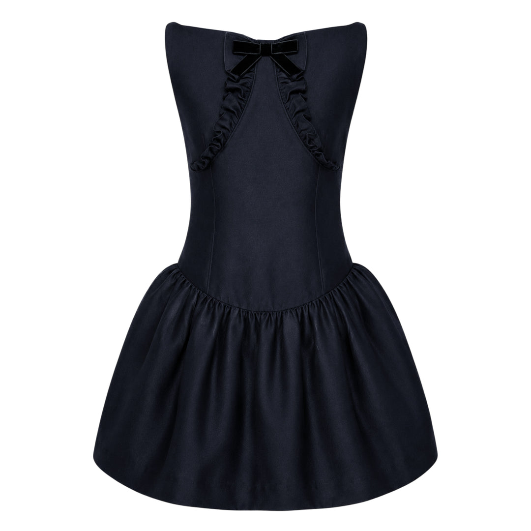 SHUSHU/TONG navy drop-waist mini dress with open keyhole back, ruffled trim detailing, velvet bow accent, and full gathered skirt — rear view