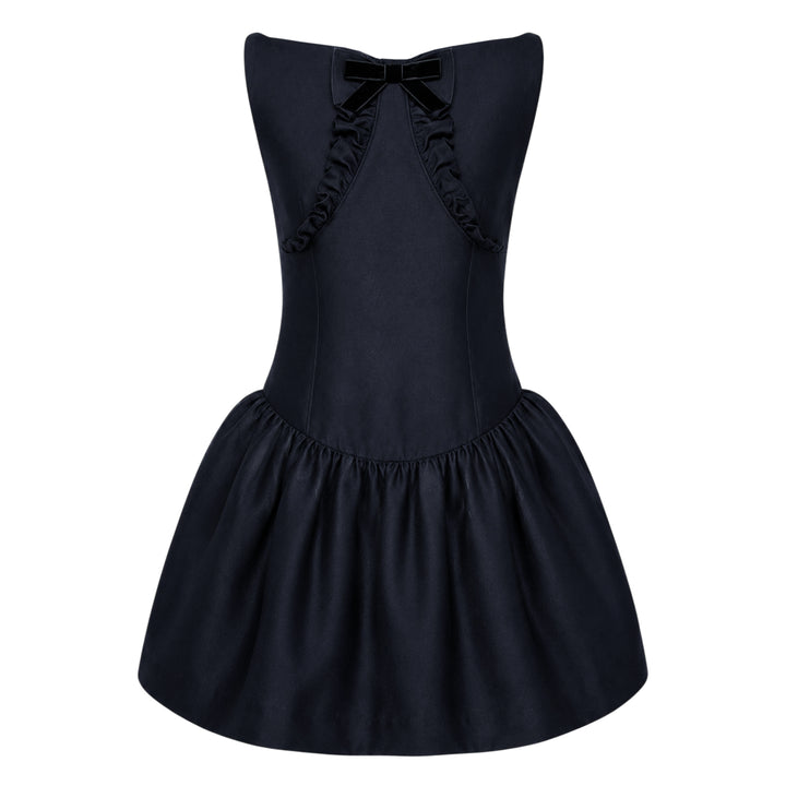 SHUSHU/TONG navy drop-waist mini dress with open keyhole back, ruffled trim detailing, velvet bow accent, and full gathered skirt — rear view