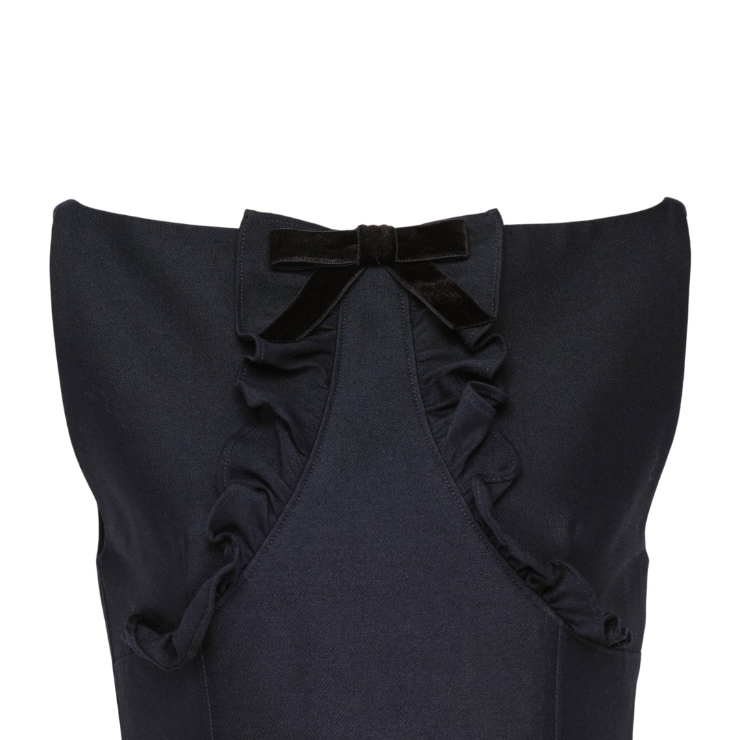 SHUSHU/TONG navy drop-waist mini dress with open keyhole back, ruffled trim detailing, velvet bow accent, and full gathered skirt — rear view
