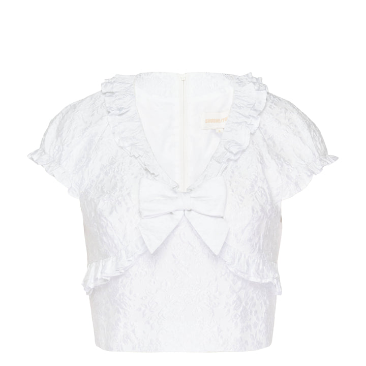 SHUSHU/TONG white jacquard ruffled bow crop top with puff sleeves, ruffle collar and hem trim, and structured satin bow at the centre front neckline, shown from the back