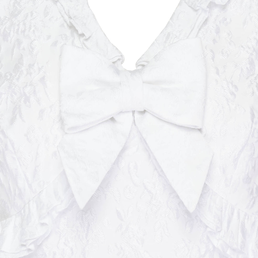 SHUSHU/TONG white jacquard ruffled bow crop top with puff sleeves, ruffle collar and hem trim, and structured satin bow at the centre front neckline, shown from the back