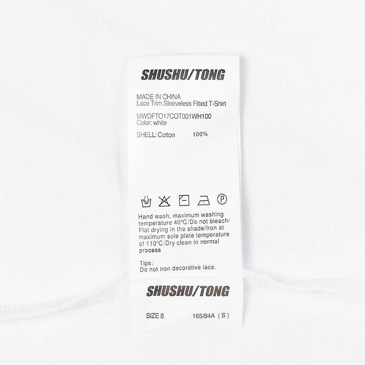 SHUSHU/TONG white sleeveless fitted top with twin vertical ruffle trim detailing running from the neckline toward the waist, shown from the front against a white background