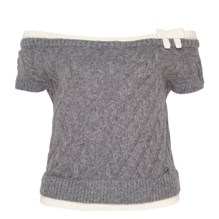 SHUSHU/TONG baby blue cable-knit off-shoulder crop top with cream contrast ribbed trim, bow accent at the neckline, and short sleeves, displayed flat on a white background