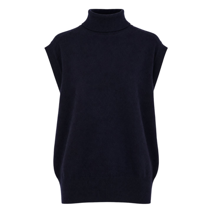Sofie D'Hoore sleeveless turtleneck knit top in deep navy, featuring a ribbed roll neck, extended cap shoulders, and a relaxed boxy silhouette