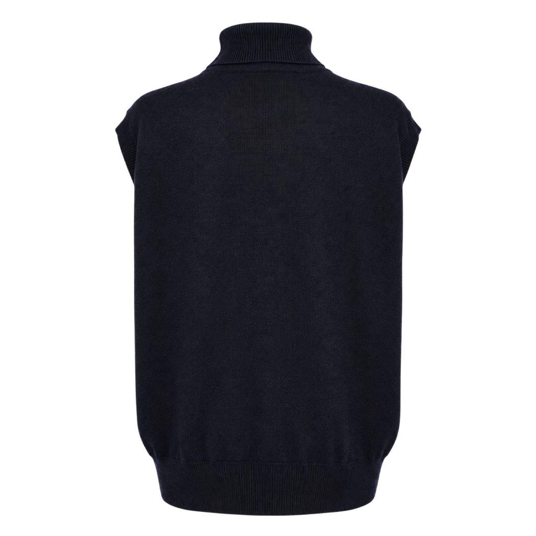 Sofie D'Hoore sleeveless turtleneck knit top in deep navy, featuring a ribbed roll neck, extended cap shoulders, and a relaxed boxy silhouette