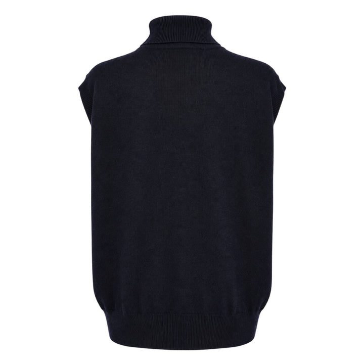 Sofie D'Hoore sleeveless turtleneck knit top in deep navy, featuring a ribbed roll neck, extended cap shoulders, and a relaxed boxy silhouette