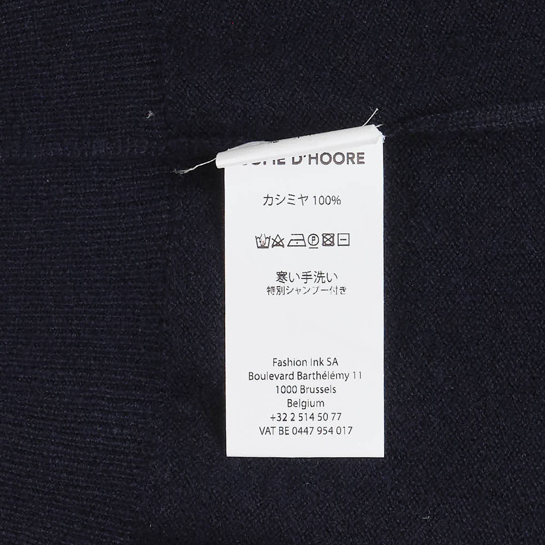 Sofie D'Hoore sleeveless turtleneck knit top in deep navy, featuring a ribbed roll neck, extended cap shoulders, and a relaxed boxy silhouette