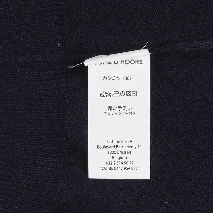 Sofie D'Hoore sleeveless turtleneck knit top in deep navy, featuring a ribbed roll neck, extended cap shoulders, and a relaxed boxy silhouette