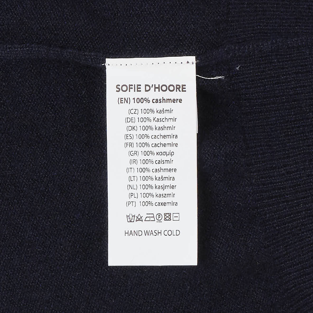 Sofie D'Hoore sleeveless turtleneck knit top in deep navy, featuring a ribbed roll neck, extended cap shoulders, and a relaxed boxy silhouette
