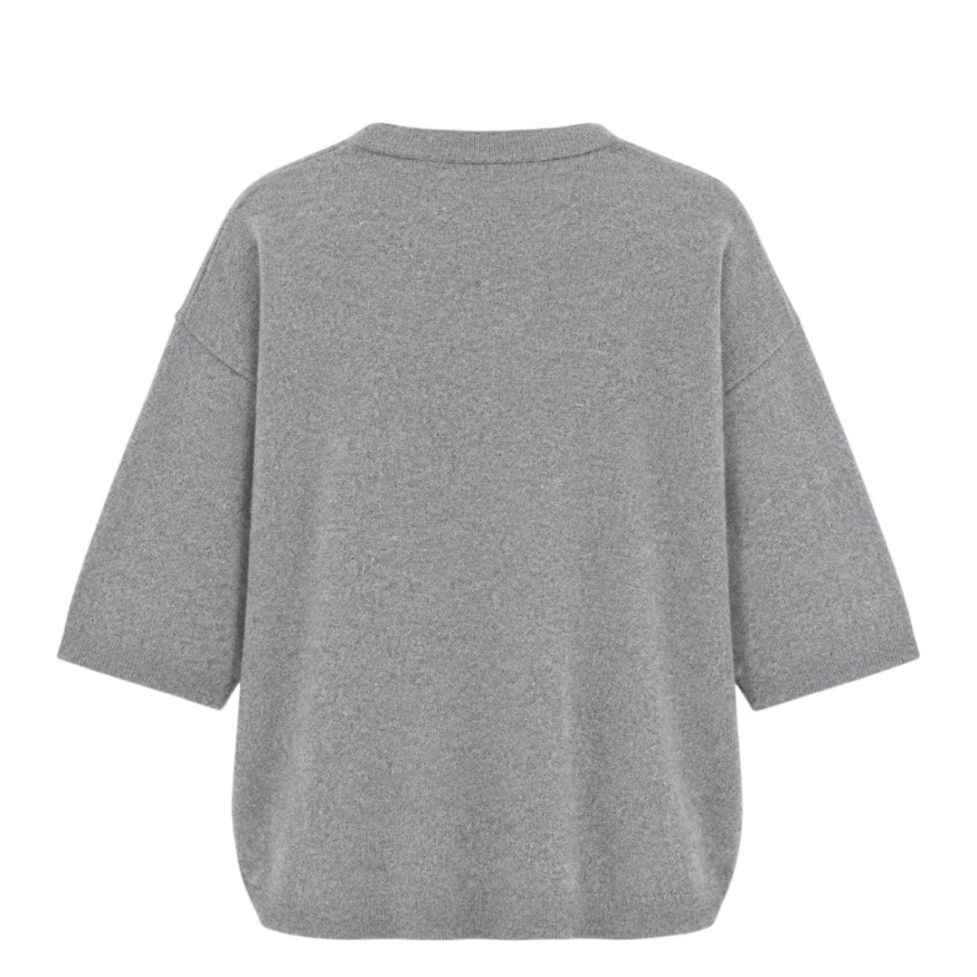 Sofie D'Hoore short sleeve knit top in heather grey with a relaxed boxy silhouette, dropped shoulders, ribbed crewneck, and ribbed cuffs, laid flat on a white background