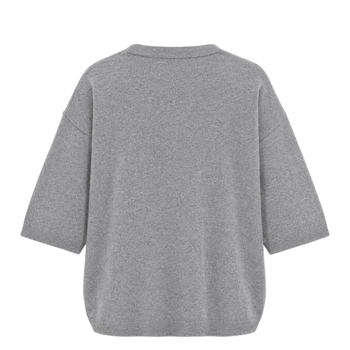 Sofie D'Hoore short sleeve knit top in heather grey with a relaxed boxy silhouette, dropped shoulders, ribbed crewneck, and ribbed cuffs, laid flat on a white background