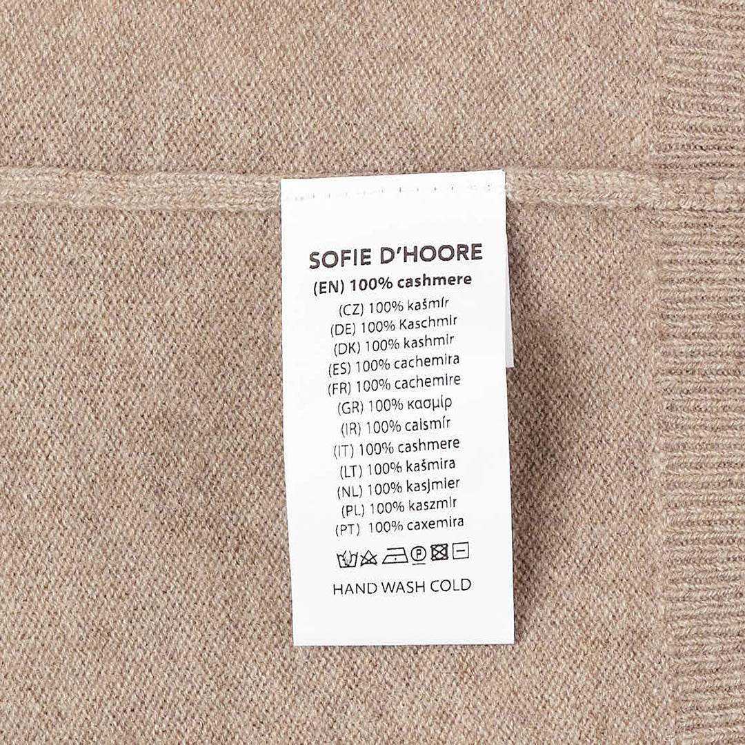 Sofie D'Hoore long sleeve crew neck sweater in camel marl knit with ribbed collar, cuffs, and hem, displayed flat on a white background