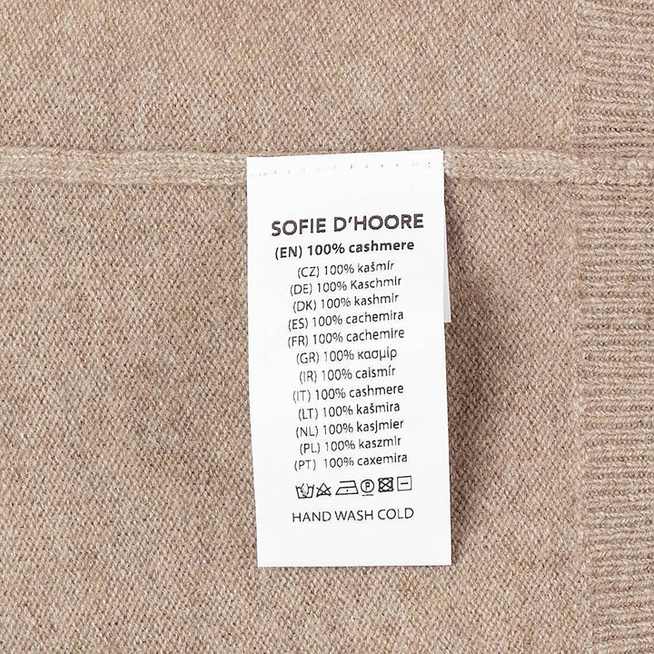 Sofie D'Hoore long sleeve crew neck sweater in camel marl knit with ribbed collar, cuffs, and hem, displayed flat on a white background