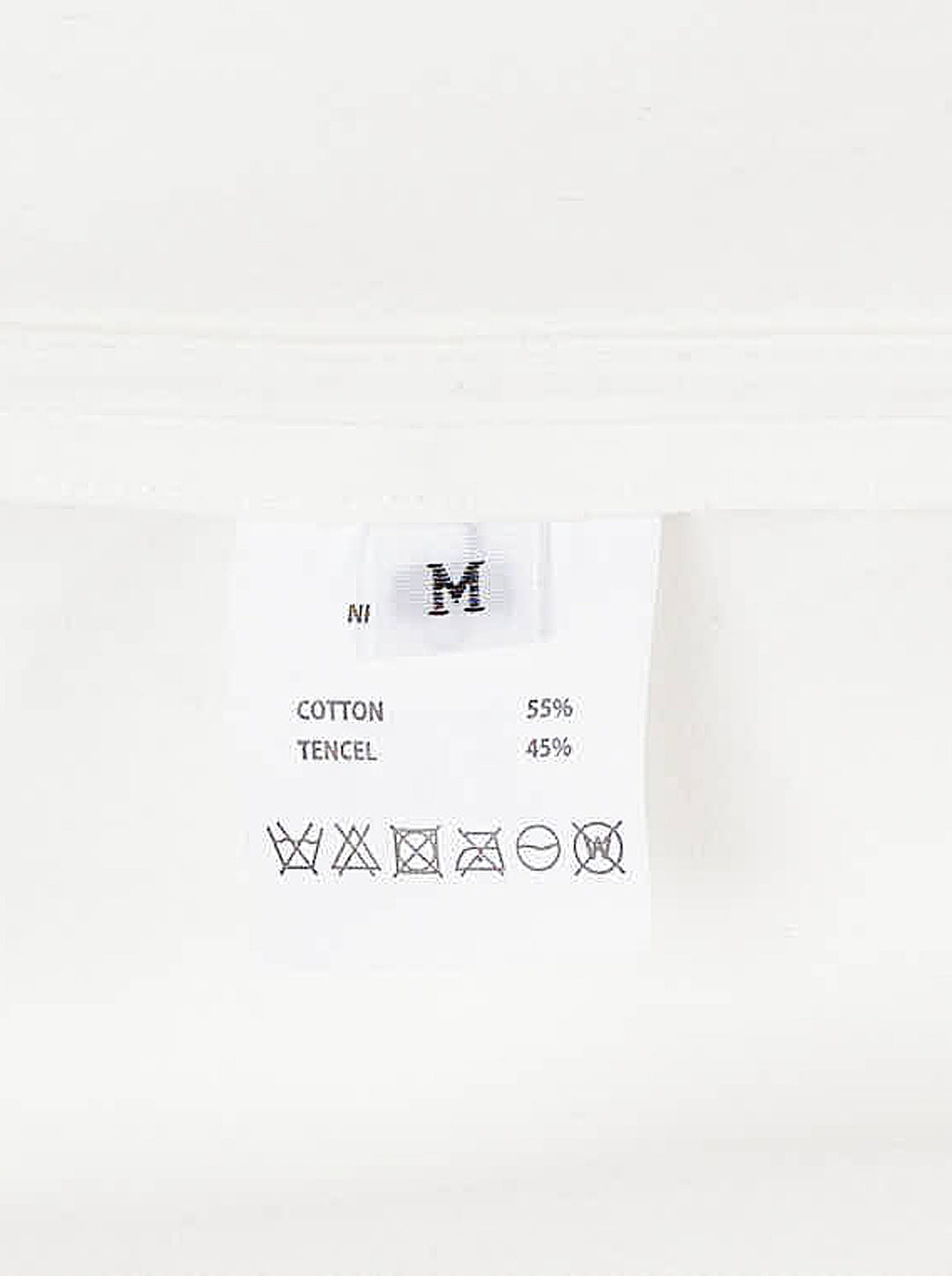 Musée RA white oversized shirt with pointed collar, button placket, chest pocket and open back tie detail, shown from the front - view 3