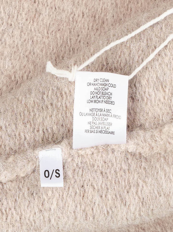 Lauren Manoogian Long Shawl Cardigan in heathered oatmeal, laid flat showing open-front silhouette, wide shawl collar, hip pockets, and woven brand label - view 4