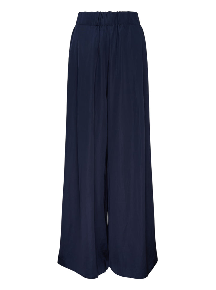Lee Mathews Powell Wide Leg Pants in navy — high-waisted, elasticated waistband with front pleat detailing and a sweeping wide-leg silhouette