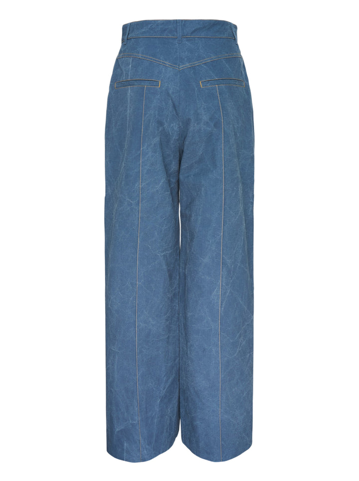 Lee Mathews Cecil Cotton Pants in crinkle-textured faded indigo blue, featuring a wide-leg silhouette, oversized patch pockets, and contrast topstitching throughout - view 2