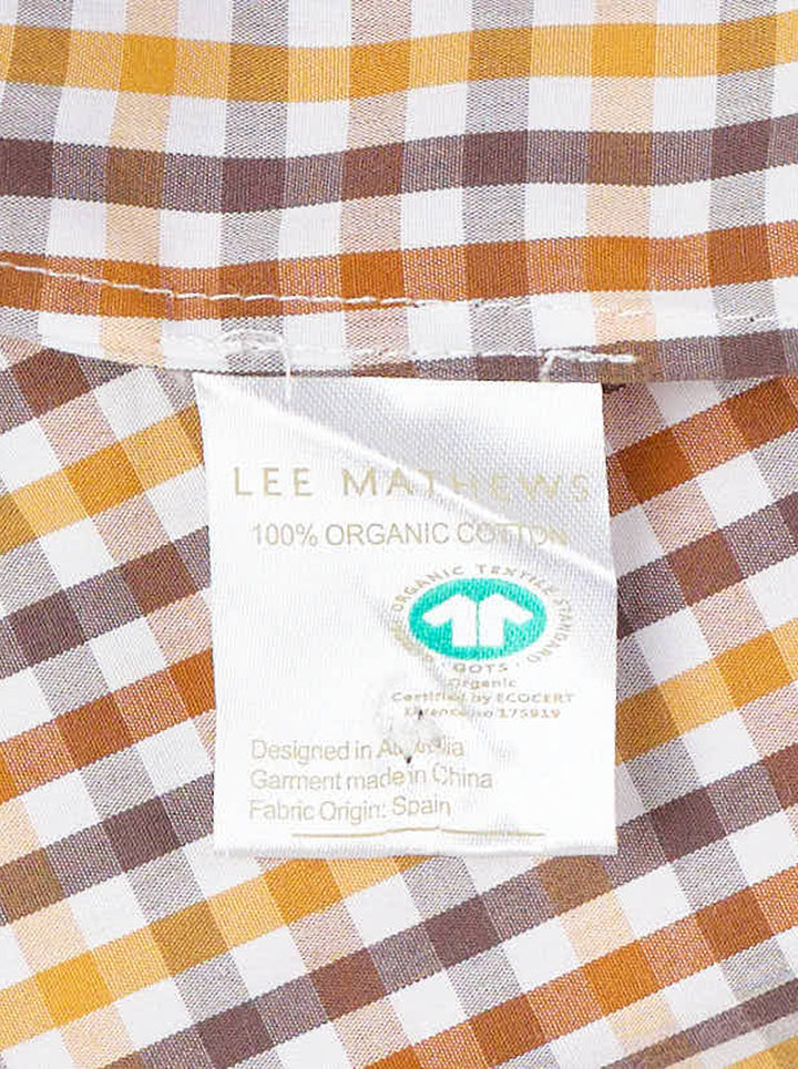 Lee Mathews Christie Poplin Check Top in an amber and brown gingham print, featuring a ruffled neckline and shoulder straps with a relaxed A-line silhouette, photographed flat on a white background - view 3