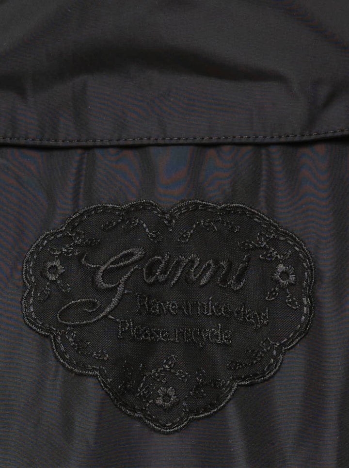 Ganni Flyweight Nylon Mini Utility Dress in black, featuring a camp collar, tonal snap button placket, oversized chest cargo pockets, and a gathered tiered flared skirt - view 3