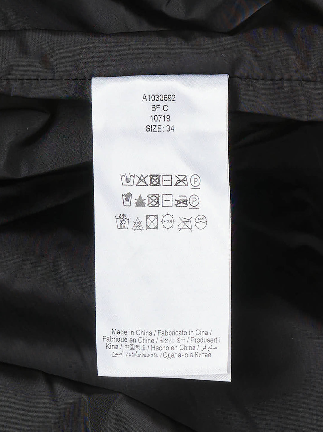 Ganni Flyweight Nylon Mini Utility Dress in black, featuring a camp collar, tonal snap button placket, oversized chest cargo pockets, and a gathered tiered flared skirt - view 4