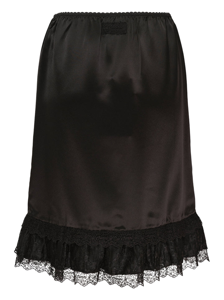 Ganni black fluid satin knee-length slip skirt with elasticated waist and tiered logo-embroidered lace frill hem - view 2