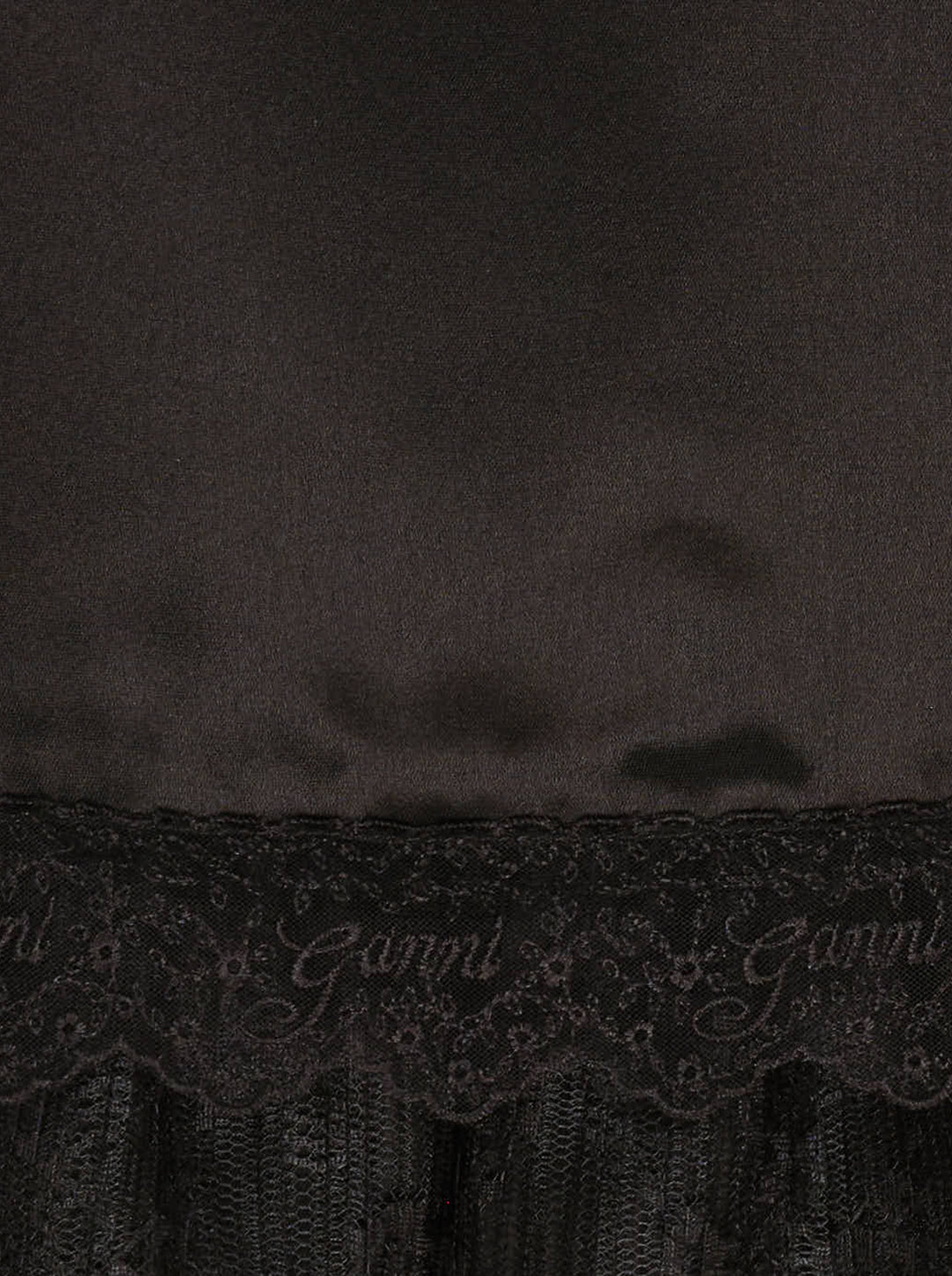 Ganni black fluid satin knee-length slip skirt with elasticated waist and tiered logo-embroidered lace frill hem - view 4