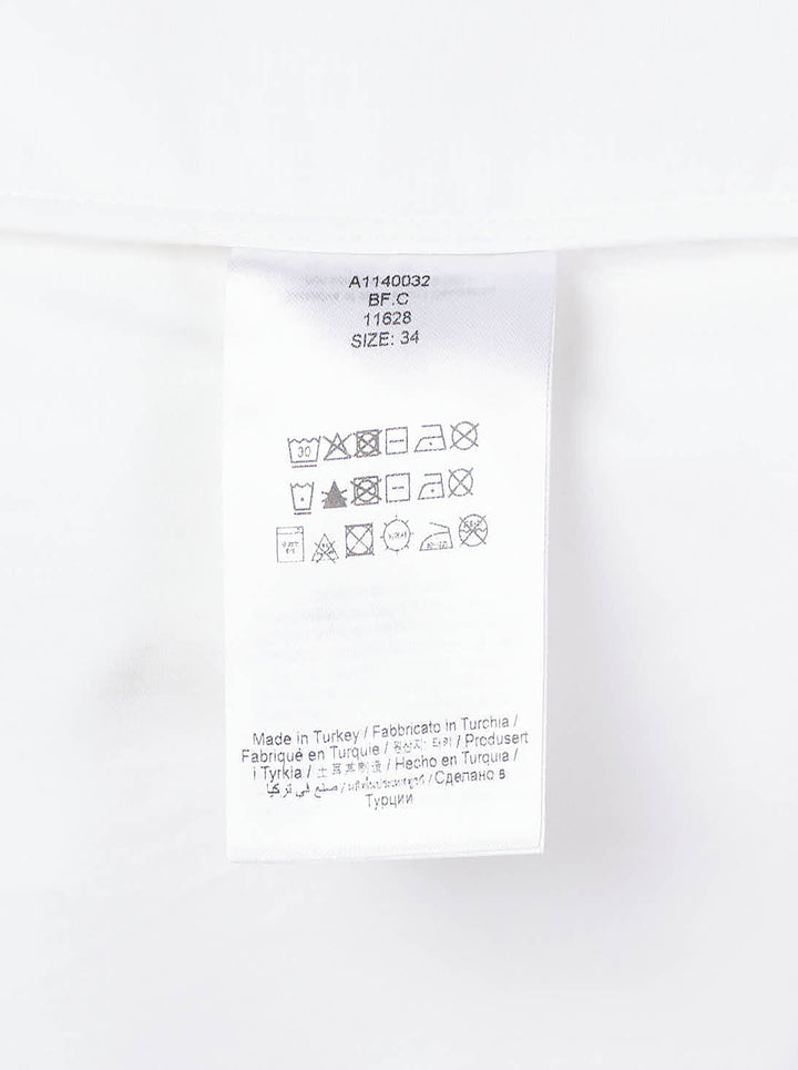 Ganni Compact Poplin Pleated Sleeve Shirt in white, featuring voluminous gathered sleeves, button-front placket with pearlescent buttons, and a patch chest pocket - view 3
