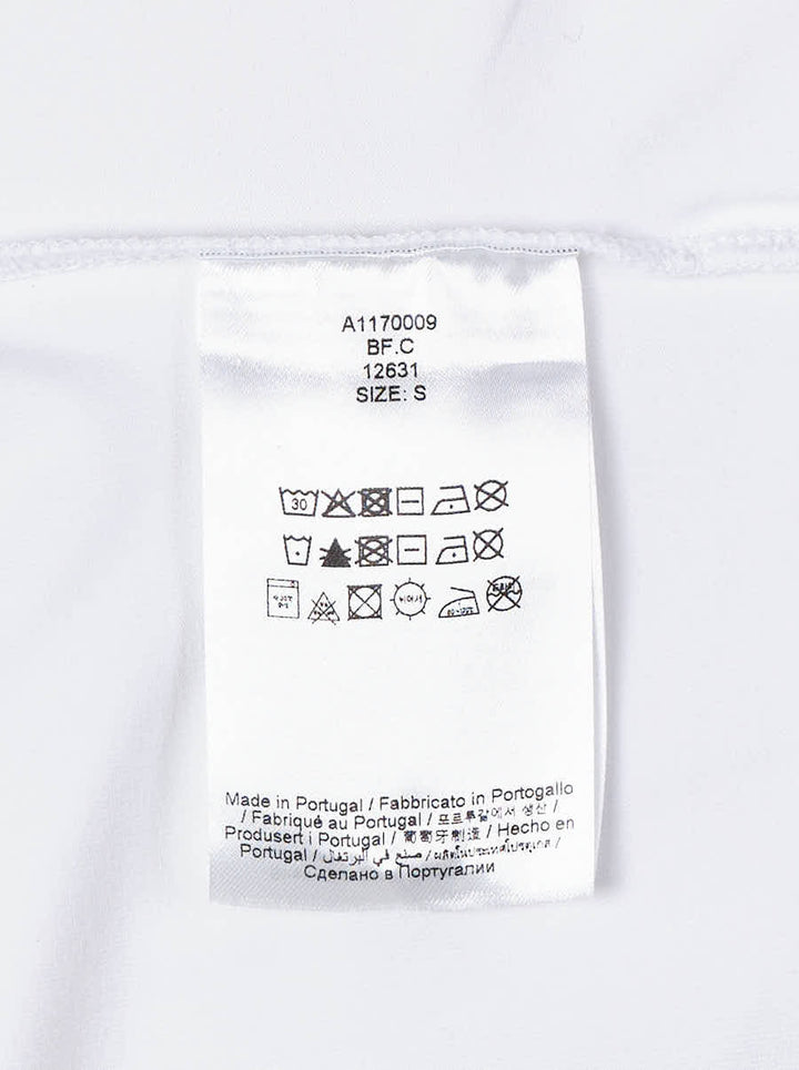 White long sleeve polo top with pointed collar, crystal buttons and ruched side draping - view 4