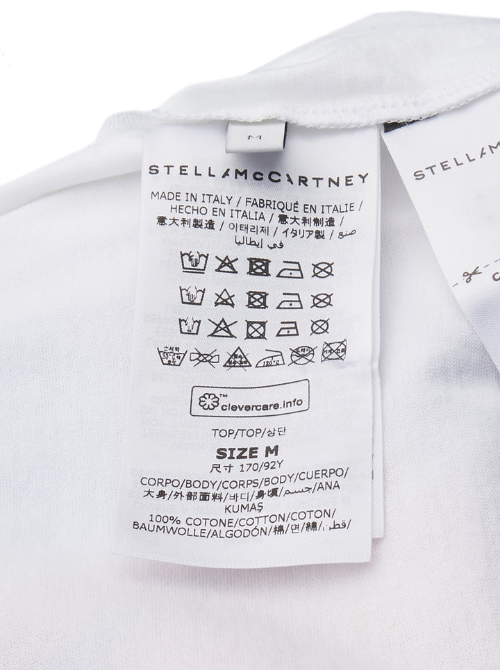 Stella McCartney Airbrush Horse Print Baseball Tee with 'Mane Attraction' script graphic on a white body and royal blue raglan three-quarter sleeves, shown flat on a white background - view 3