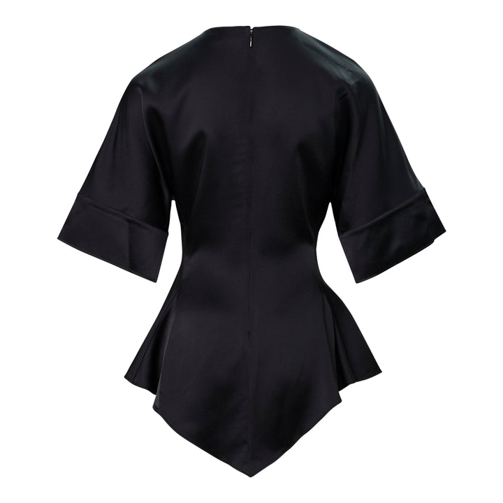 Stella McCartney black satin peplum top with wide folded cuffs, fitted waist, and asymmetric flared hem, photographed on a white background - view 2