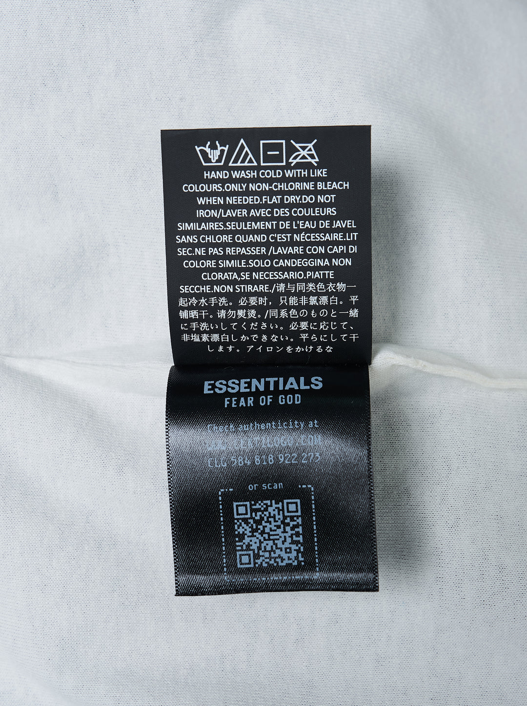 Fear of God ESSENTIALS Classic Double Layer Tee in black with white undertee at the neckline and hem and tonal embroidered logo at the chest - view 4