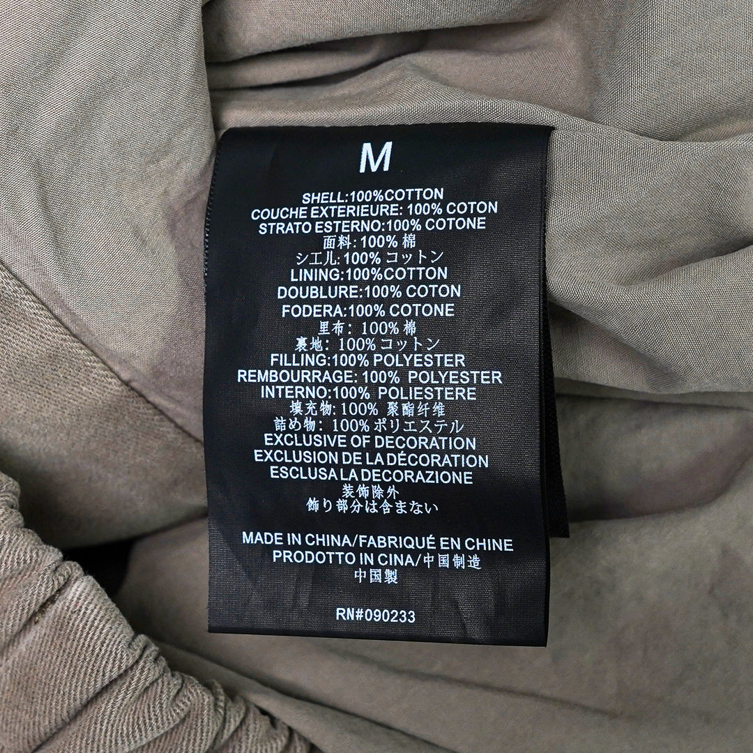 Fear of God Essentials Modern Filled Blouson Jacket in taupe, featuring a full-length zip, stand collar, raglan sleeves, and elasticated hem and cuffs, shown flat on a white background - view 3