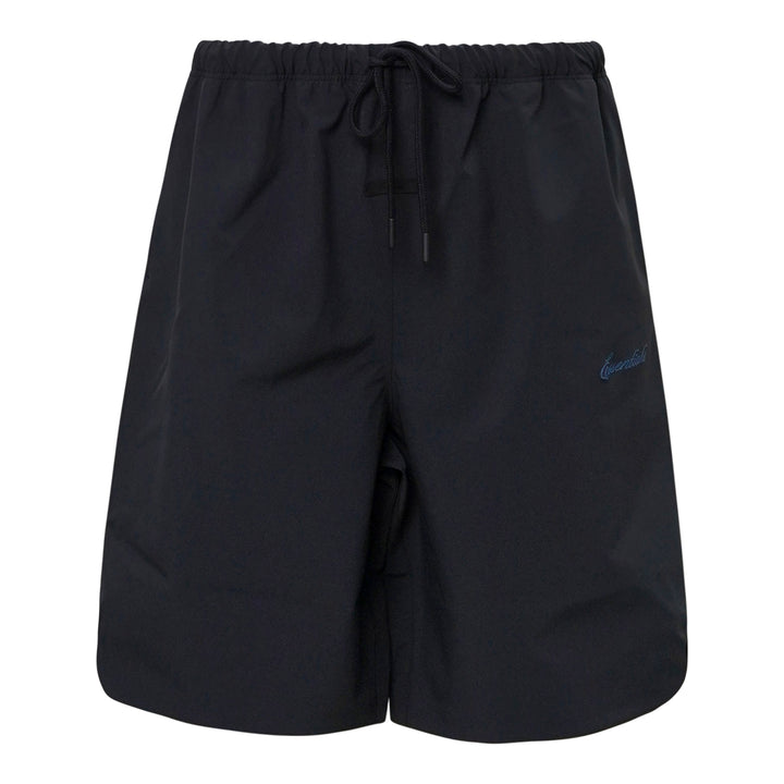 Fear of God Essentials Signature Relaxed Shorts in black, featuring an elasticated drawstring waistband, wide-leg silhouette, and tonal script logo embroidery on the front panel