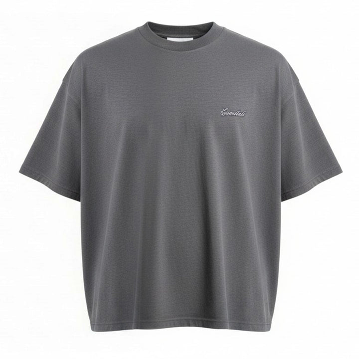 Fear of God Essentials Signature Short Sleeve Tee in washed grey, featuring an oversized boxy silhouette, ribbed crewneck, and tonal script logo at the chest
